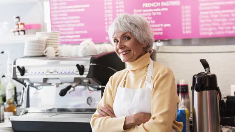 Older worker in a cafe.